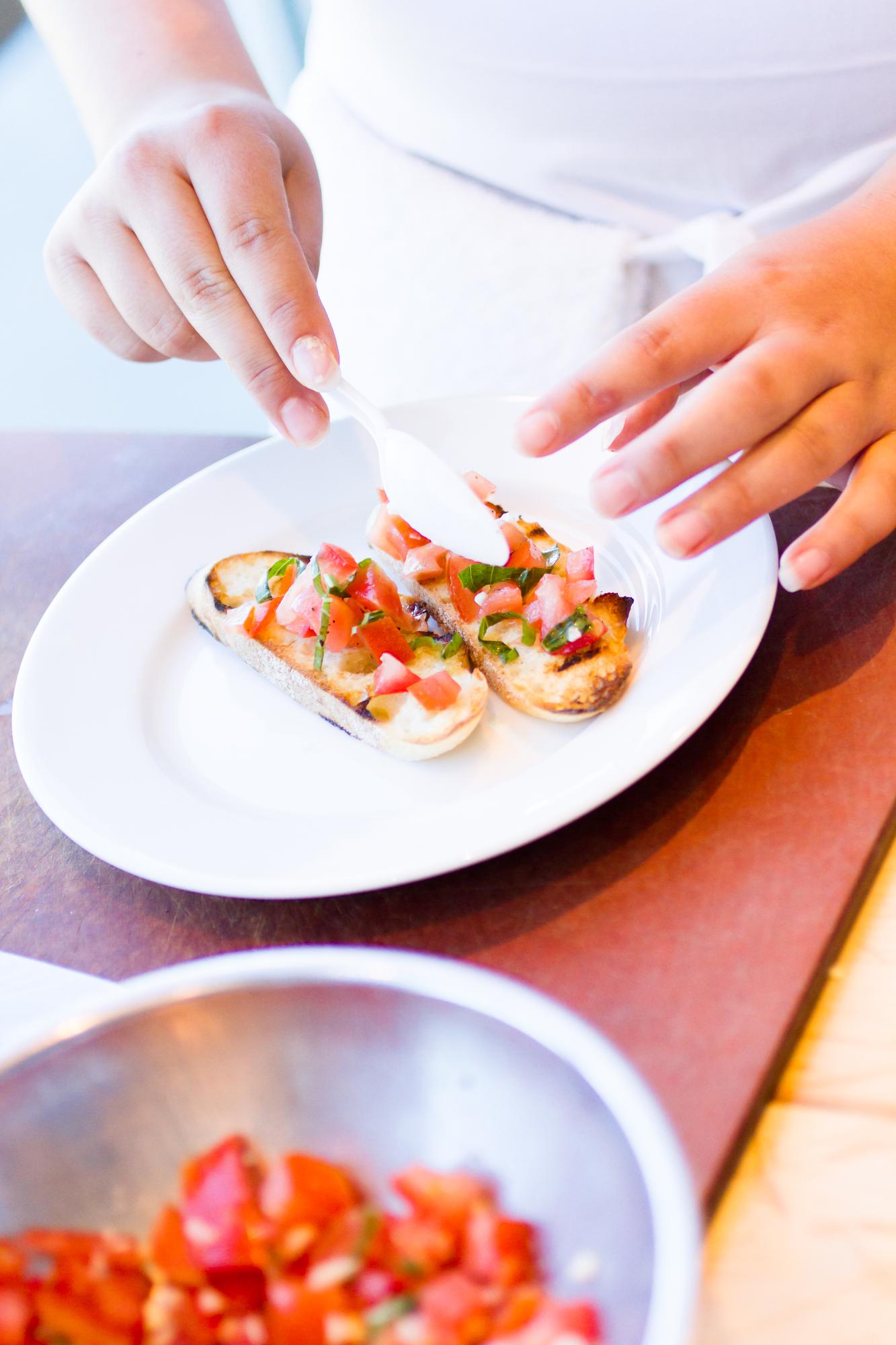 Participants plating dishes at a workshop